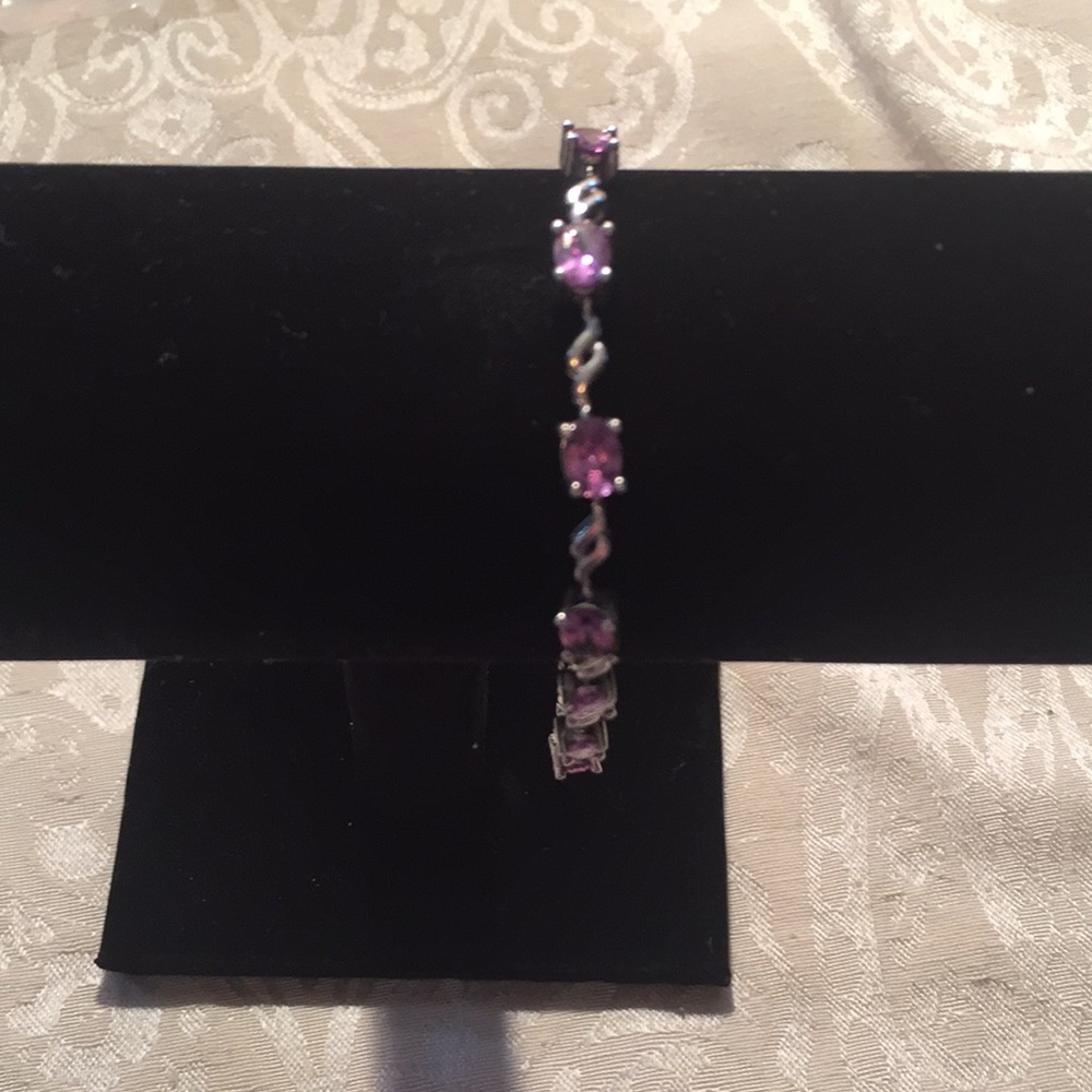 Sterling and amethyst tennis bracelet.